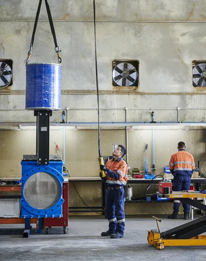 Beaver technicians servicing a knife gate valve in the workshop