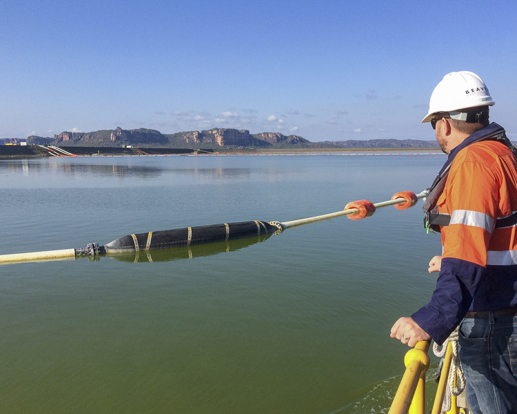 Floating rubber dredge suction hose in a tailings pond