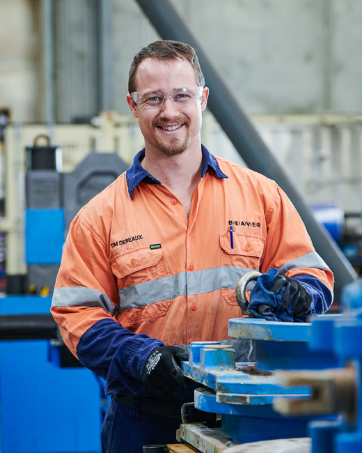 A service tech working on a mining slurry valve repair