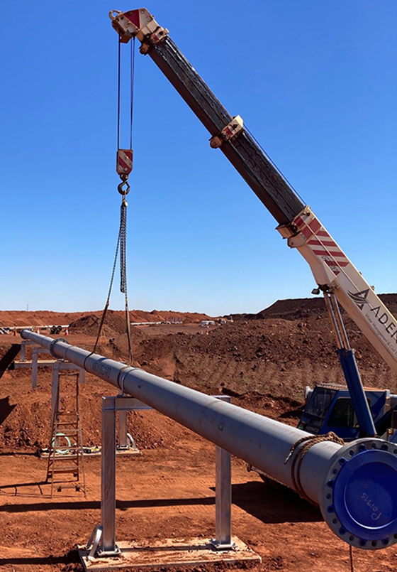 Image of an Abrasiguard pipeline being installed with a crane